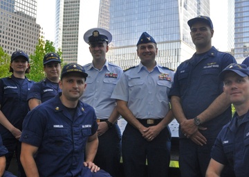 Petty Officer Robert McNeill and members of the Sector New York Incident Management Division gather at the 9/11 Memorial during his re-enlistment ceremony May 22, 2016.