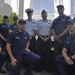 Petty Officer Robert McNeill and members of the Sector New York Incident Management Division gather at the 9/11 Memorial during his re-enlistment ceremony May 22, 2016.