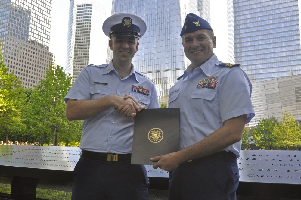 Petty Officer Robert McNeill and his supervisor Lt. Cmdr. Arthur Hudman during his re-enlistment ceremony May 22, 2016.
