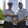 Petty Officer Robert McNeill and his supervisor Lt. Cmdr. Arthur Hudman during his re-enlistment ceremony May 22, 2016.
