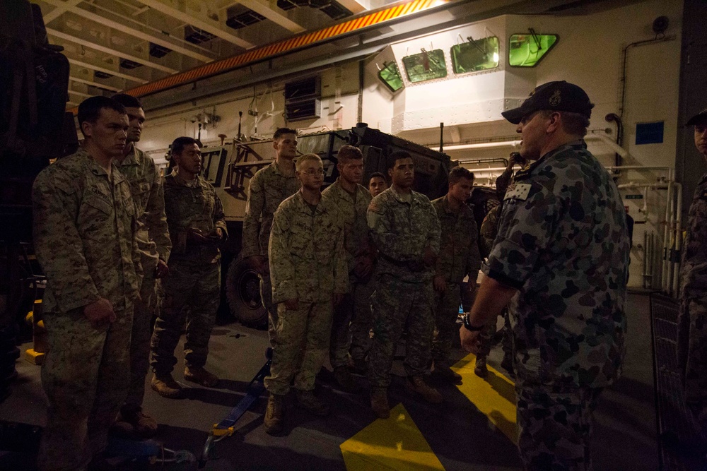 U.S. Marines and soldiers tour Australian landing craft aboard HMAS Adelaide