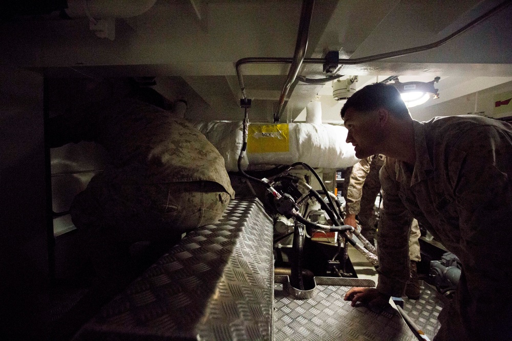 U.S. Marines and soldiers tour Australian landing craft aboard HMAS Adelaide