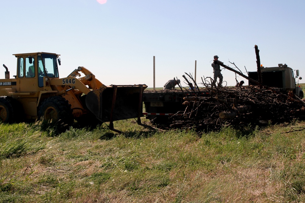 Soldiers supply timber to local tribal communities