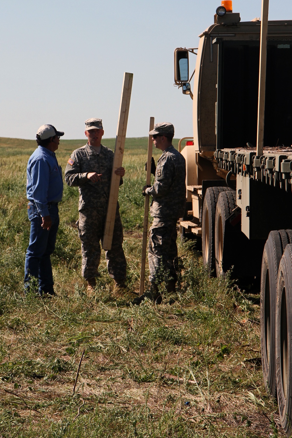 Soldiers supply timber to local tribal communities