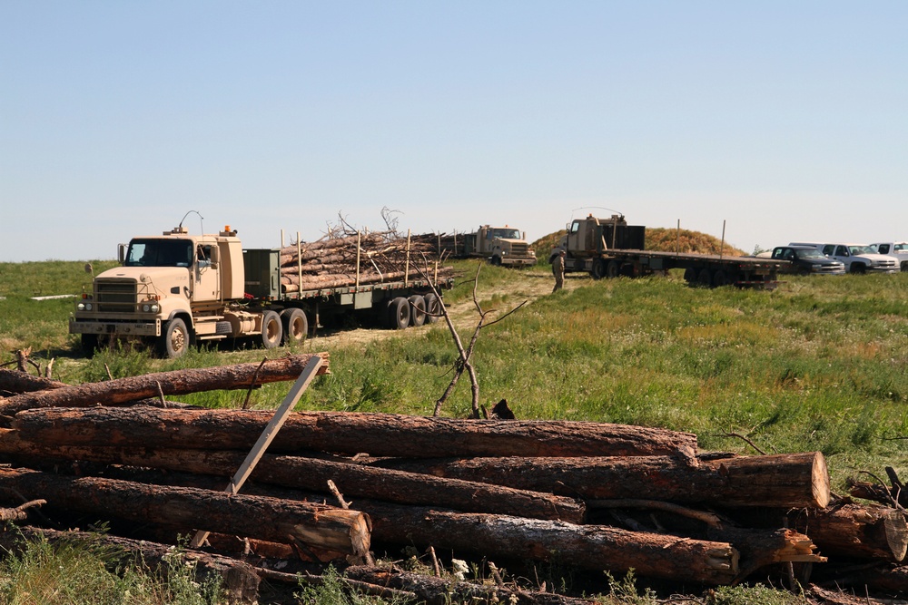 Soldiers supply timber to local tribal communities