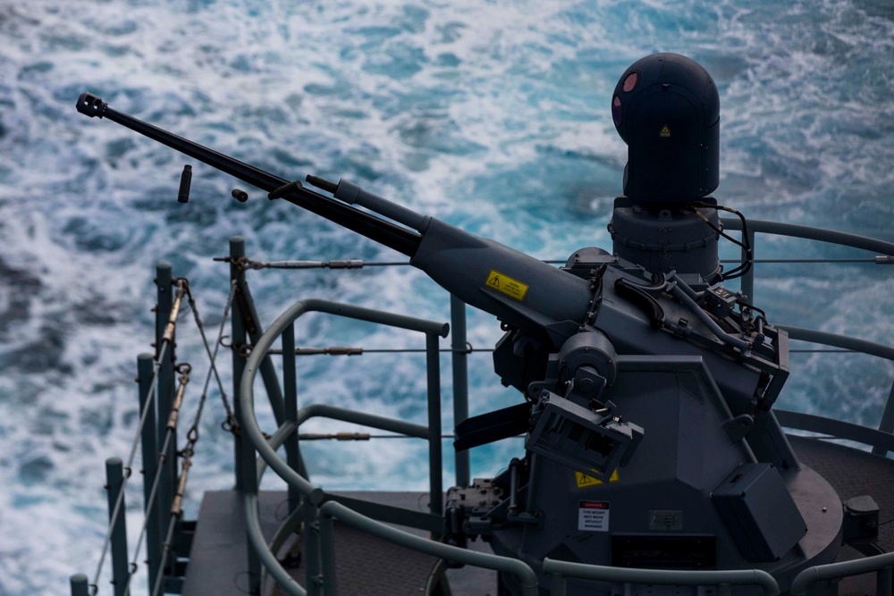 Australian sailors fire 25 millimeter Typhoon off HMAS Adelaide