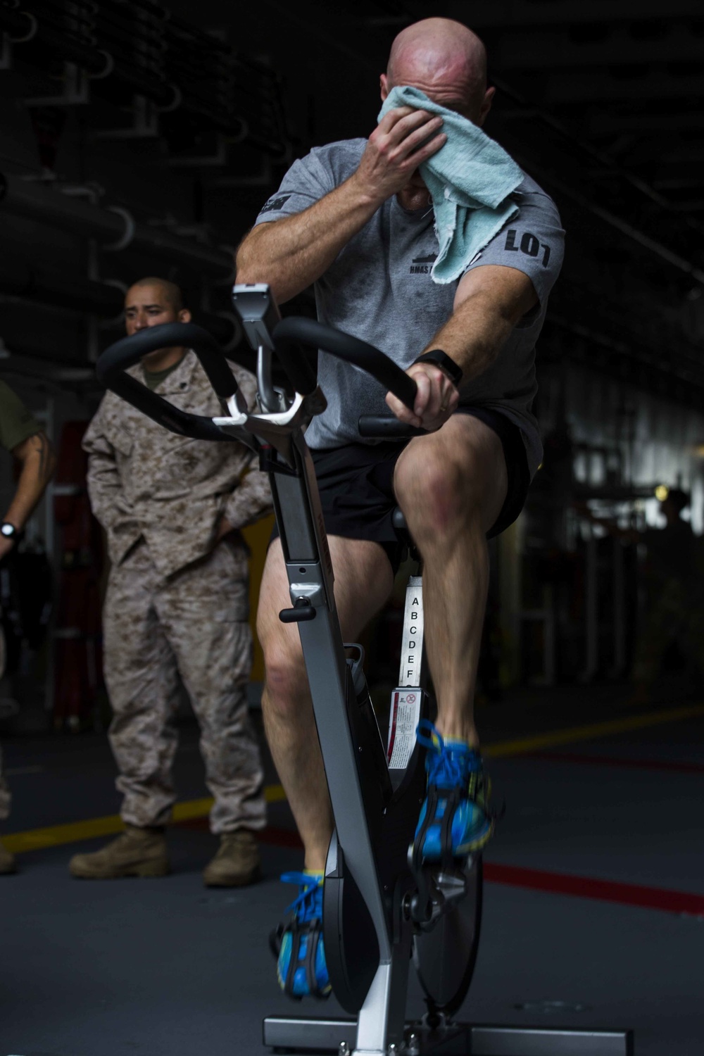 U.S. and Australian forces compete in cycling challenge aboard HMAS Adelaide