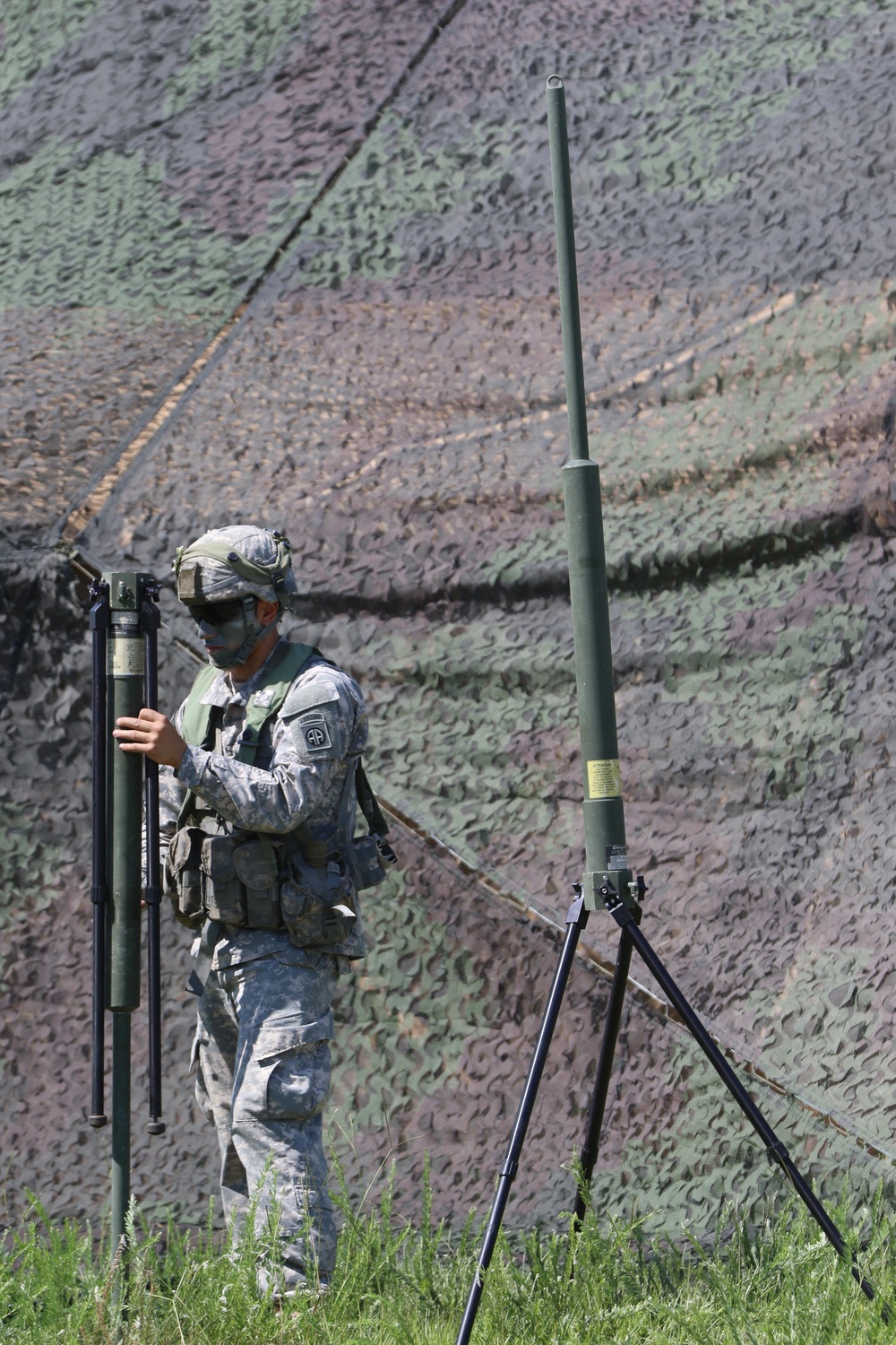 Paratroopers install communication equipment during Operation Panther Shield