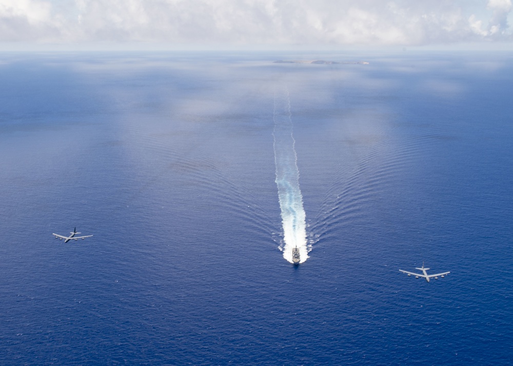 USS Spruance (DDG 111) and U.S. Air Force B-52 bombers in Formation