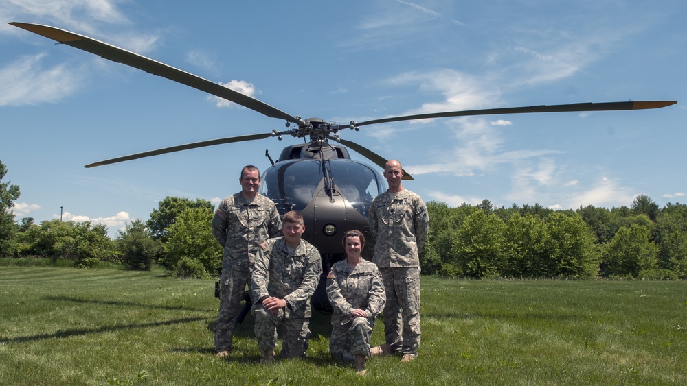 Soldiers Pose in Front of a UH-72 Lakota Helicopter