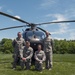 Soldiers Pose in Front of a UH-72 Lakota Helicopter
