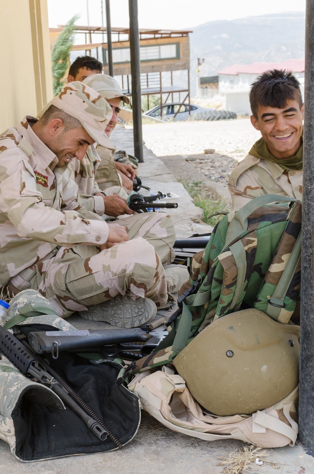 Peshmerga soldiers conduct weapons maintenance