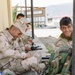 Peshmerga soldiers conduct weapons maintenance