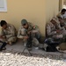 Peshmerga soldiers conduct weapons maintenance