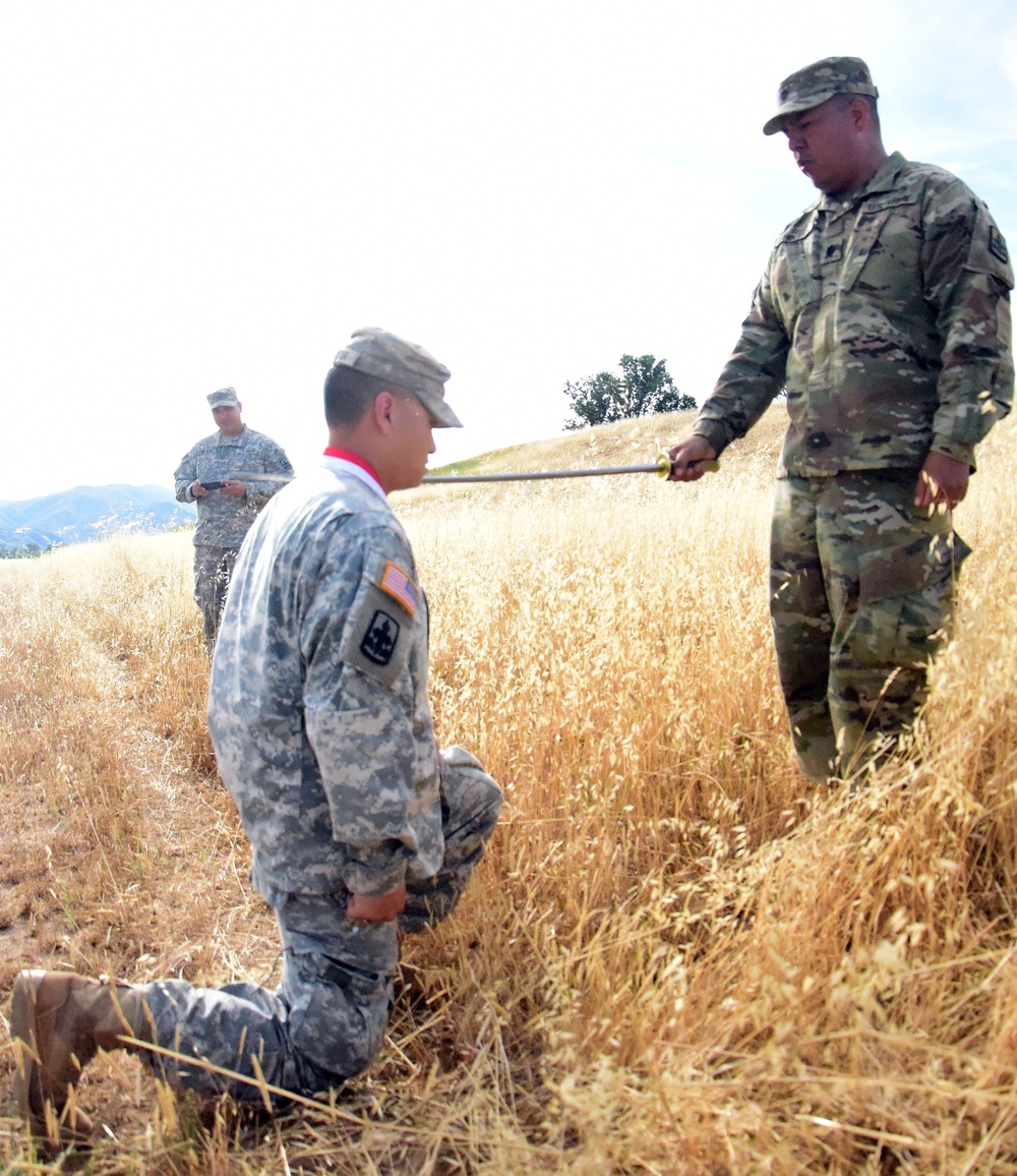 299th Cavalry Regiment inducts a fellow Soldier into Knighthood during XCTC 2016