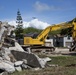 Tearing down buildings, raising up homes