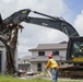 Tearing down buildings, raising up homes