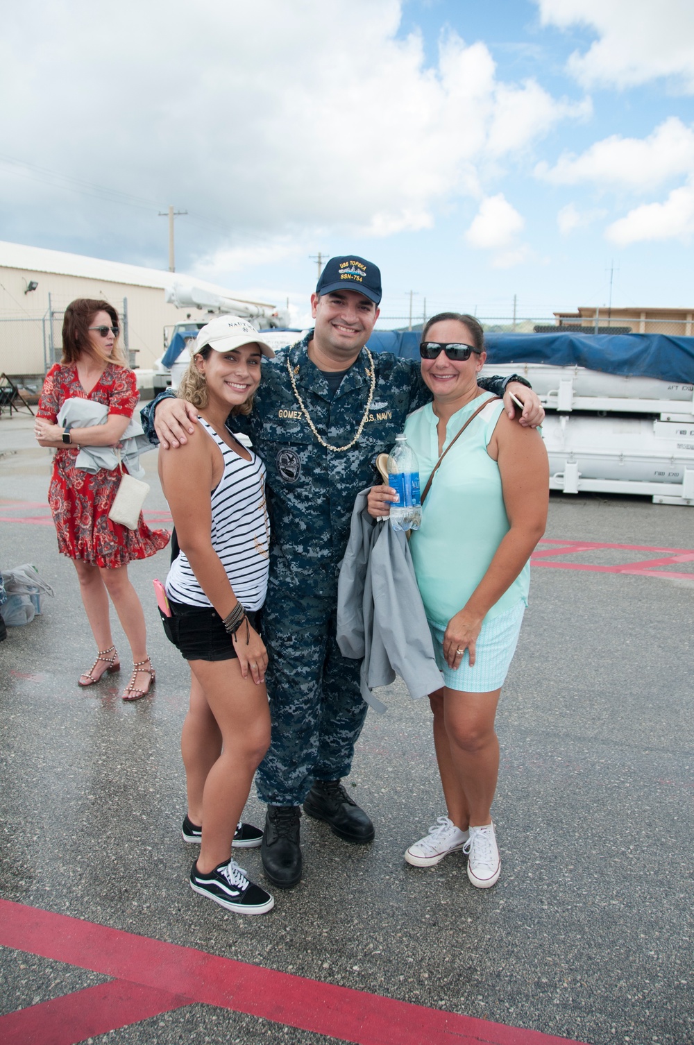 USS Topeka Sailor poses with family after returning home