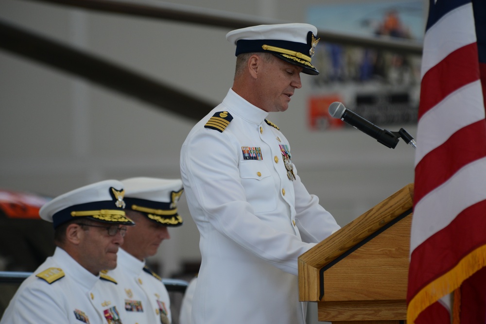 Capt. Kent W. Everingham reads his orders assuming command of Coast Guard Air Station San Francisco