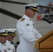 Capt. Kent W. Everingham reads his orders assuming command of Coast Guard Air Station San Francisco