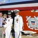 Rear Adm. Callahan stands with Cmdr. Florentino and her family in front of the Coast Guard Cutter Cypress