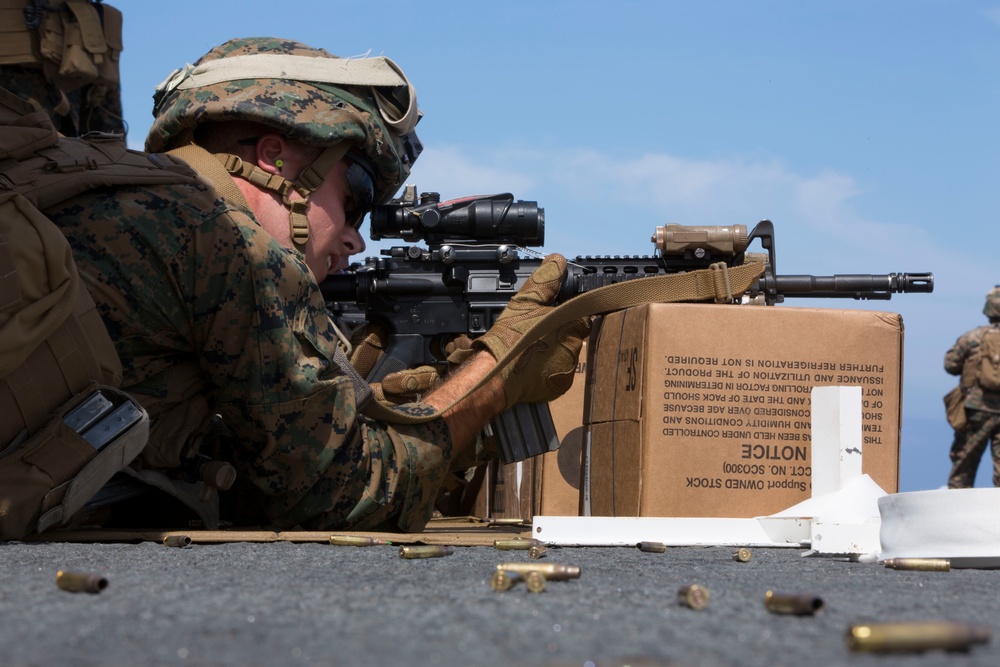 22nd MEU Alpha Co Marines fire weapons aboard Wasp