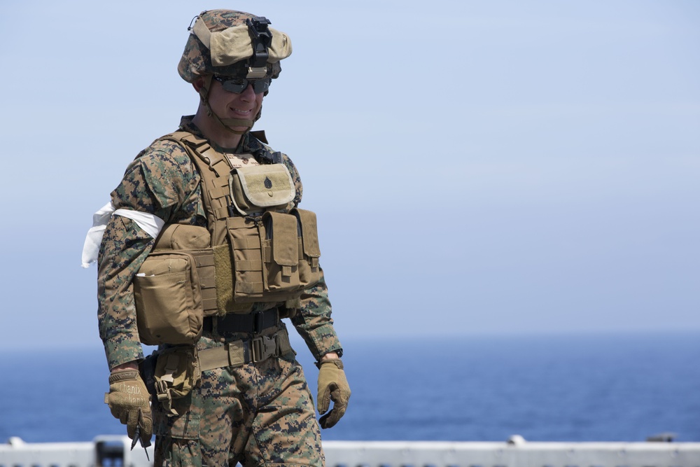 22nd MEU Alpha Co Marines fire weapons aboard Wasp