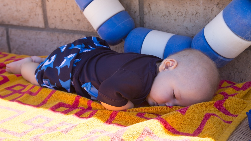 Brayden Dacier, 5 months, enjoys a restful nap after a rigorous day at the Marine Corps Community Services All American BBQ held at the Oasis Swimming Pool and Water Park aboard Marine Corps Logistics Base Barstow, July 4.