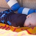 Brayden Dacier, 5 months, enjoys a restful nap after a rigorous day at the Marine Corps Community Services All American BBQ held at the Oasis Swimming Pool and Water Park aboard Marine Corps Logistics Base Barstow, July 4.