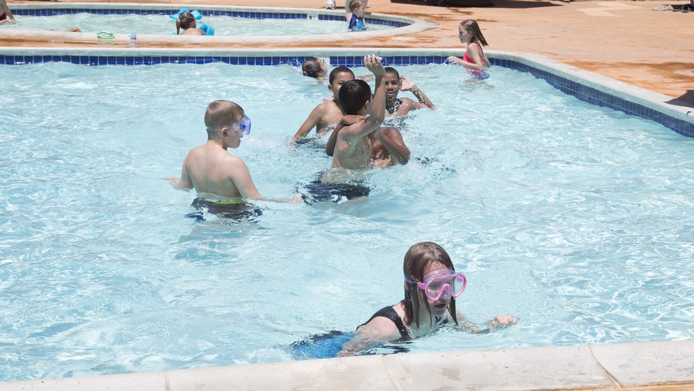 Military families enjoy pool play during the All American BBQ held at the Oasis Pool and Water Park aboard Marine Corps Logistics Base Barstow, Calif., July 4.