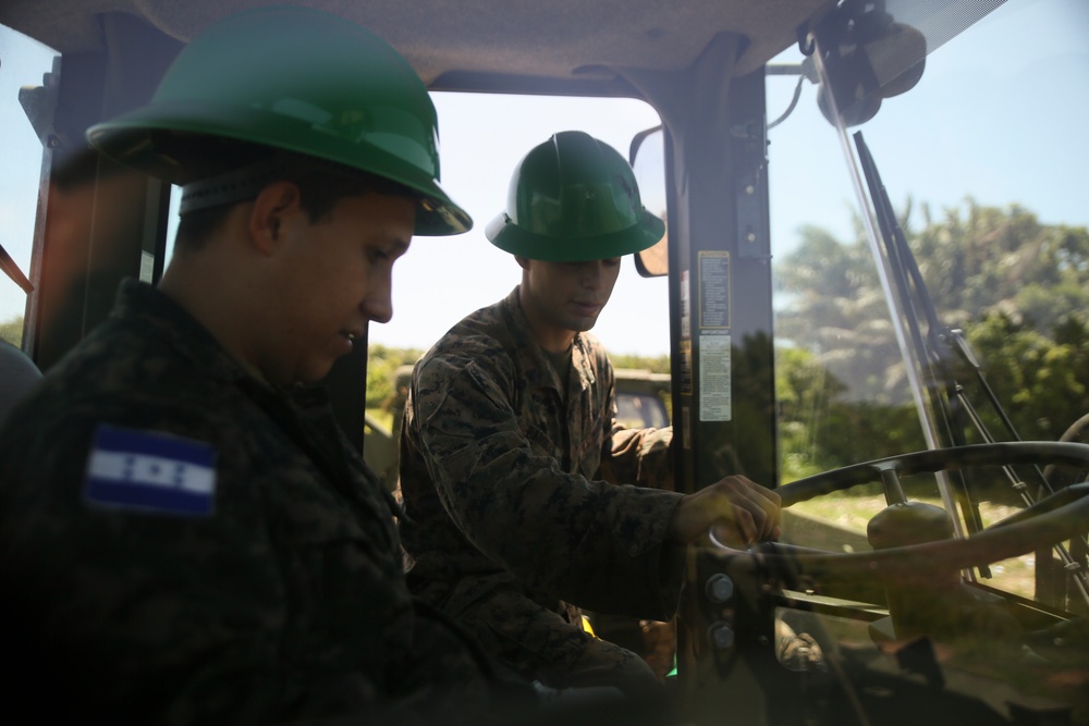 SPMAGTF-SC Engineer Marines participate in horizontal construction projects alongside Hondurans