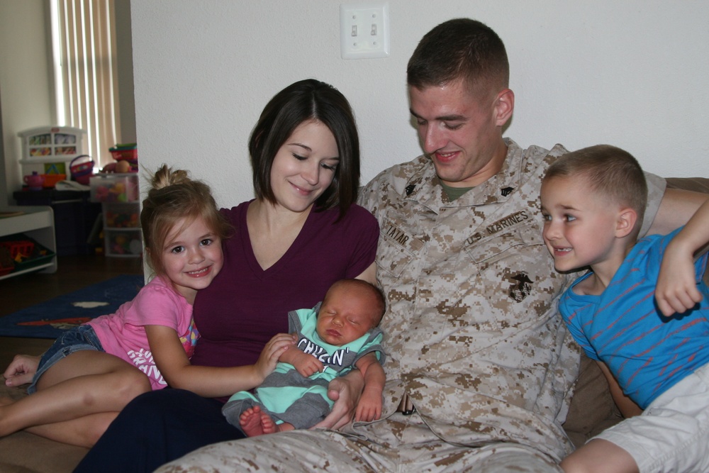 Marine helps his wife deliver baby in car aboard Marine Corps Base Quantico