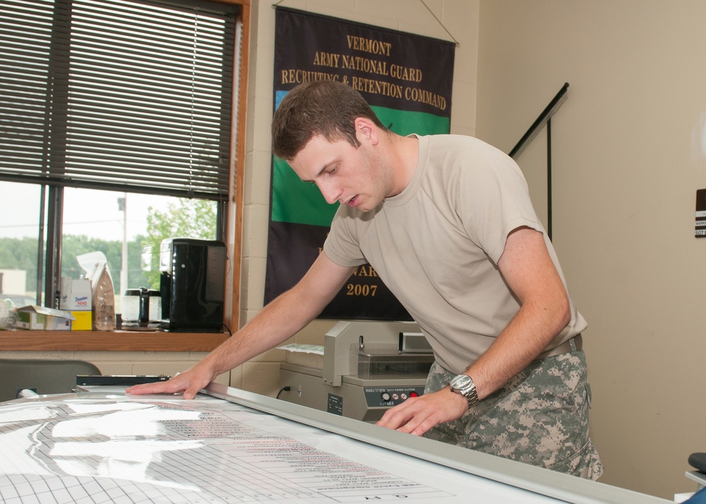 Soldier in Marketing Prepares Equipment Tracking Board