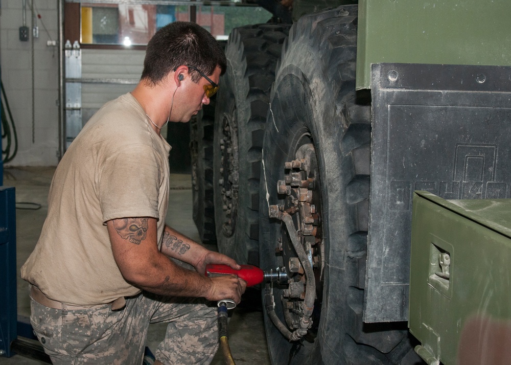 Mechanic Tightens Wheel Lug Nuts