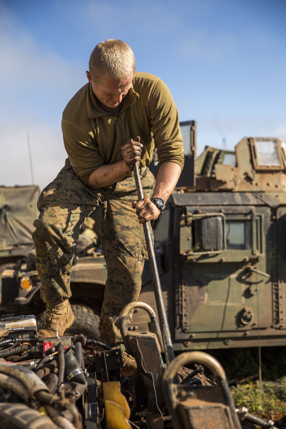 Marines turning wrenches, storming trenches