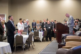 Chaplain Bradley Walgren  leads a prayer at the 2016 Statewide Symposium in Support of Service Members, Veterans and their Families, at the Desert Willow conference center April 20-21.