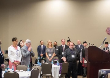 Chaplain Bradley Walgren  leads a prayer at the 2016 Statewide Symposium in Support of Service Members, Veterans and their Families, at the Desert Willow conference center April 20-21.