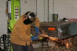 Metal Worker Cuts Away [Image 4 of 6]