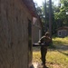 Marine Engineer student breaches a building door with a battering ram