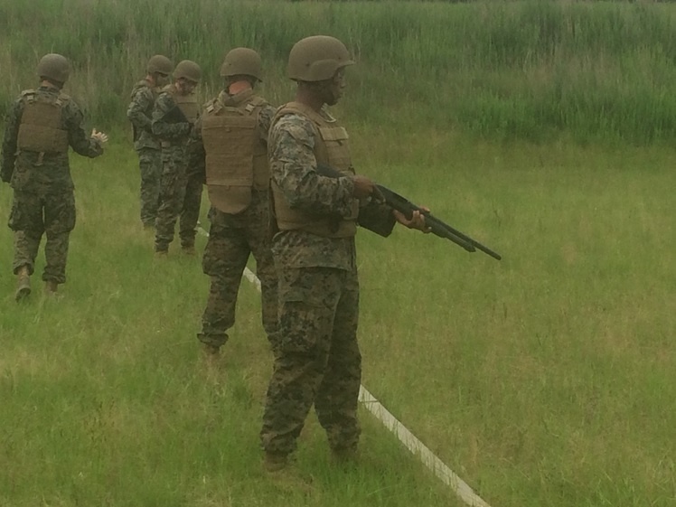 Combat Engineer students fire  shotguns during a familiarity fire