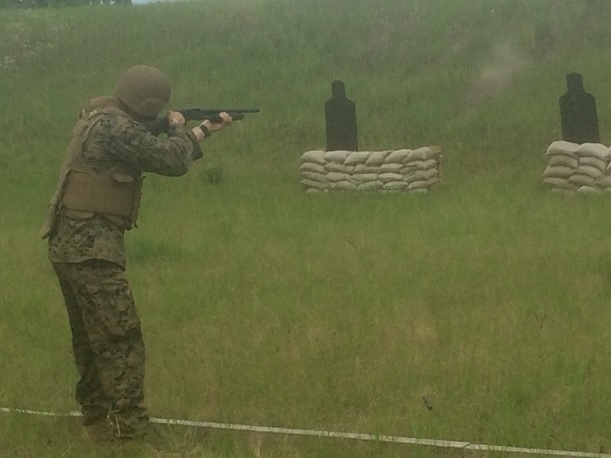 Combat Engineer student fires a shotgun during a familiarity fire