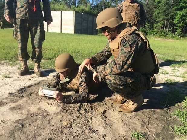 Marines attached to Combat Engineer Officer course 5-16 emplace a Claymore Mine