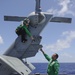 Sailors conduct flight operations onboard USS Howard