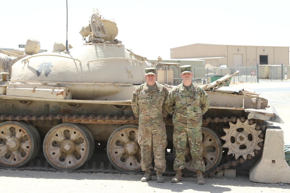 Deployed Soldier reunites with father in Kuwait