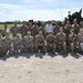 Secretary of the Army poses with Sustainment Training Center staff during recent visit