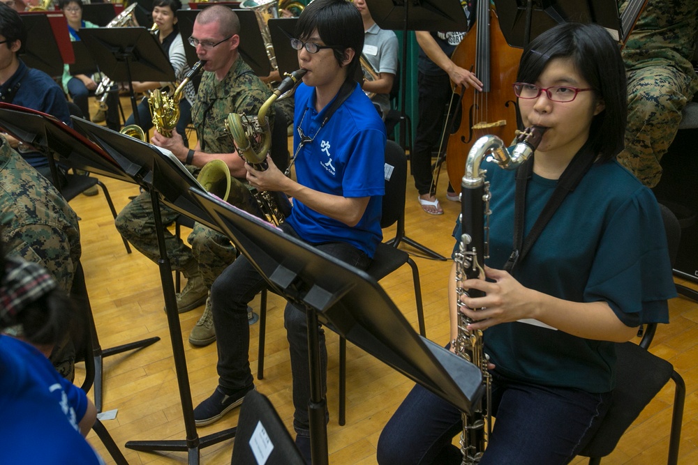 III MEF Band, local university bridge gap through music