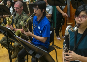 III MEF Band, local university bridge gap through music