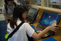 Okinawan librarians visit, exchange at Camp Foster library