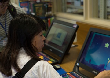 Okinawan librarians visit, exchange at Camp Foster library
