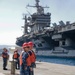 Sailors stand by as the aircraft carrier USS Harry S. Truman (CVN 75) arrives at Naval Support Activity Souda Bay